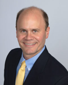 LNC Executive Director Wes Benedict headshot, suit & tie (color photo)