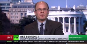 Television screen image of Wes Benedict on RT TV, text reads: "Live, RT, Wes Benedict, Executive Director, Libertarian National Committee, in Washington DC" (color image)