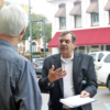 Danny Bedwell asks a pedestrian to sign a petition in Lowndes County, Miss